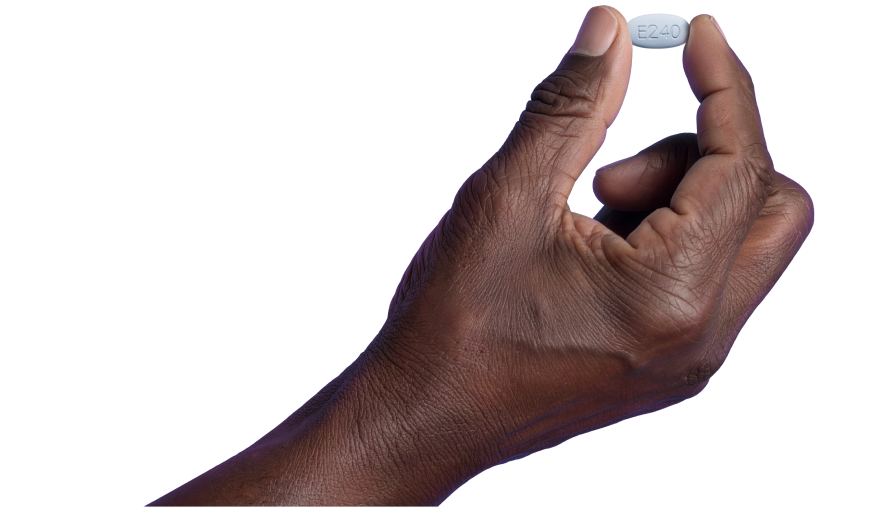 A close-up of a person's hand holding a single white ERLEADA 240 mg tablet, marked with the code 'E240'